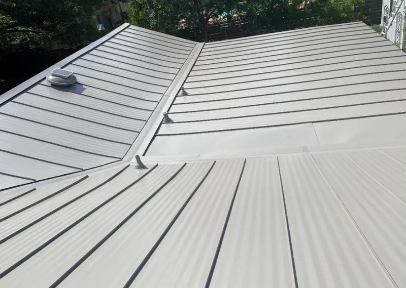 Solar attic fan installed on a metal roof for Roof Ventilation in Smyrna
